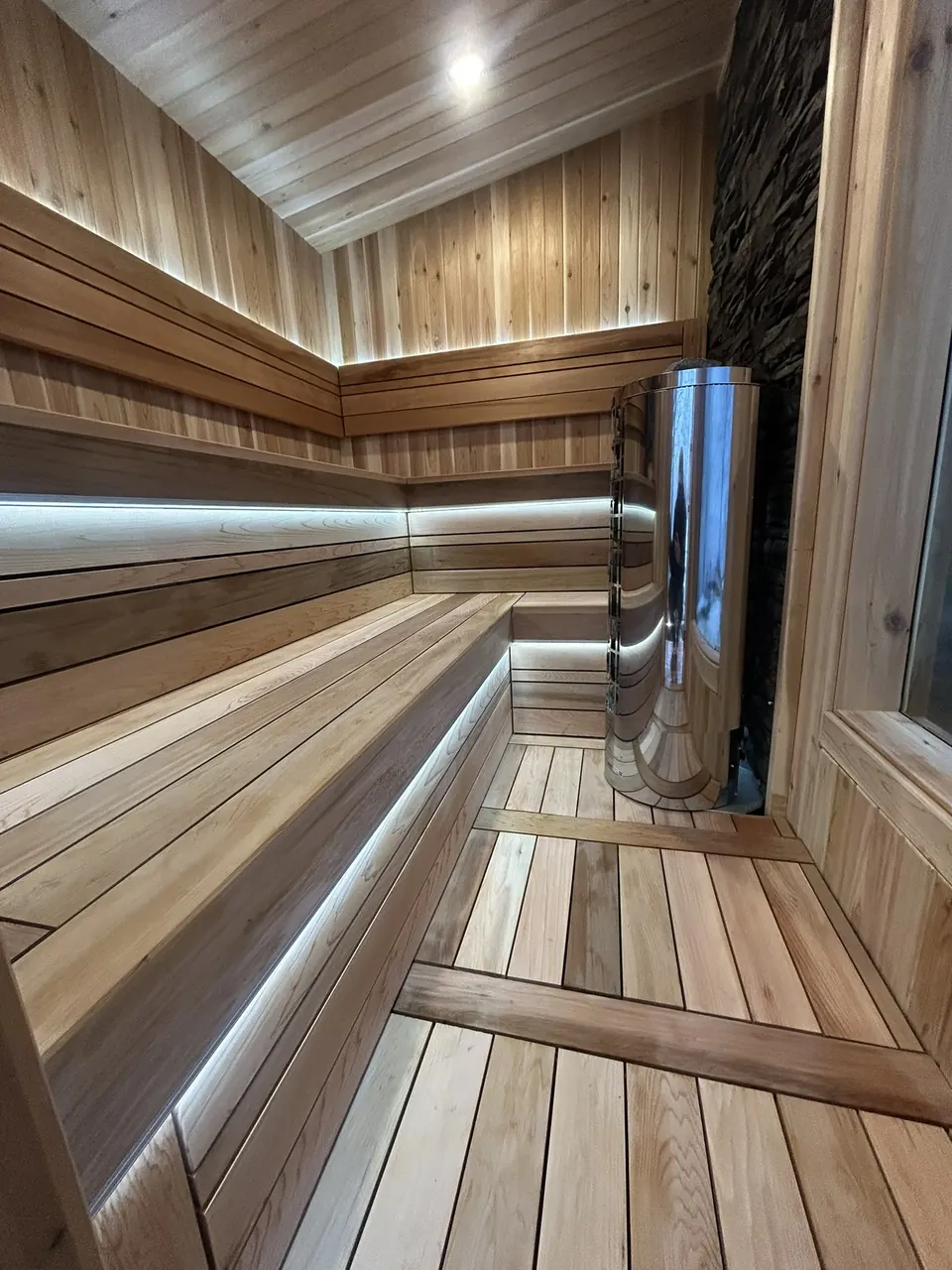 Backyard sauna: interior benches and heater
