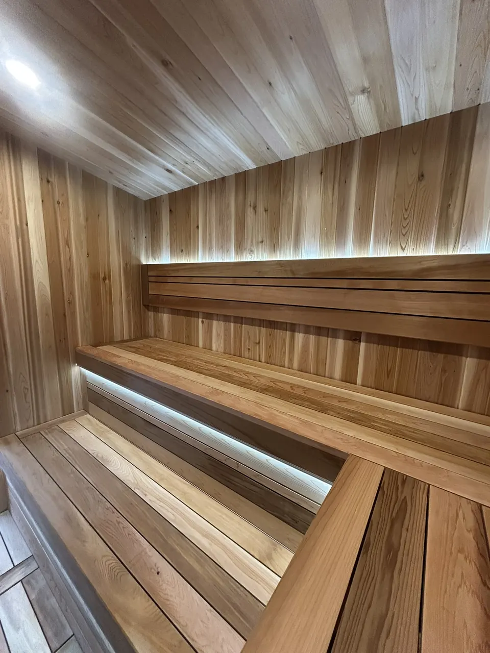 Backyard sauna: bench and wall detail