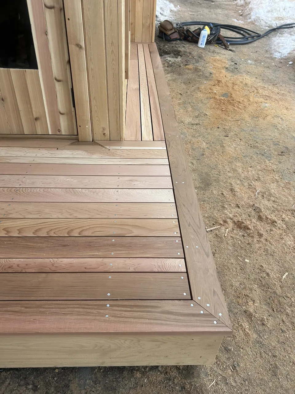 Backyard sauna: sauna entrance deck border in progress