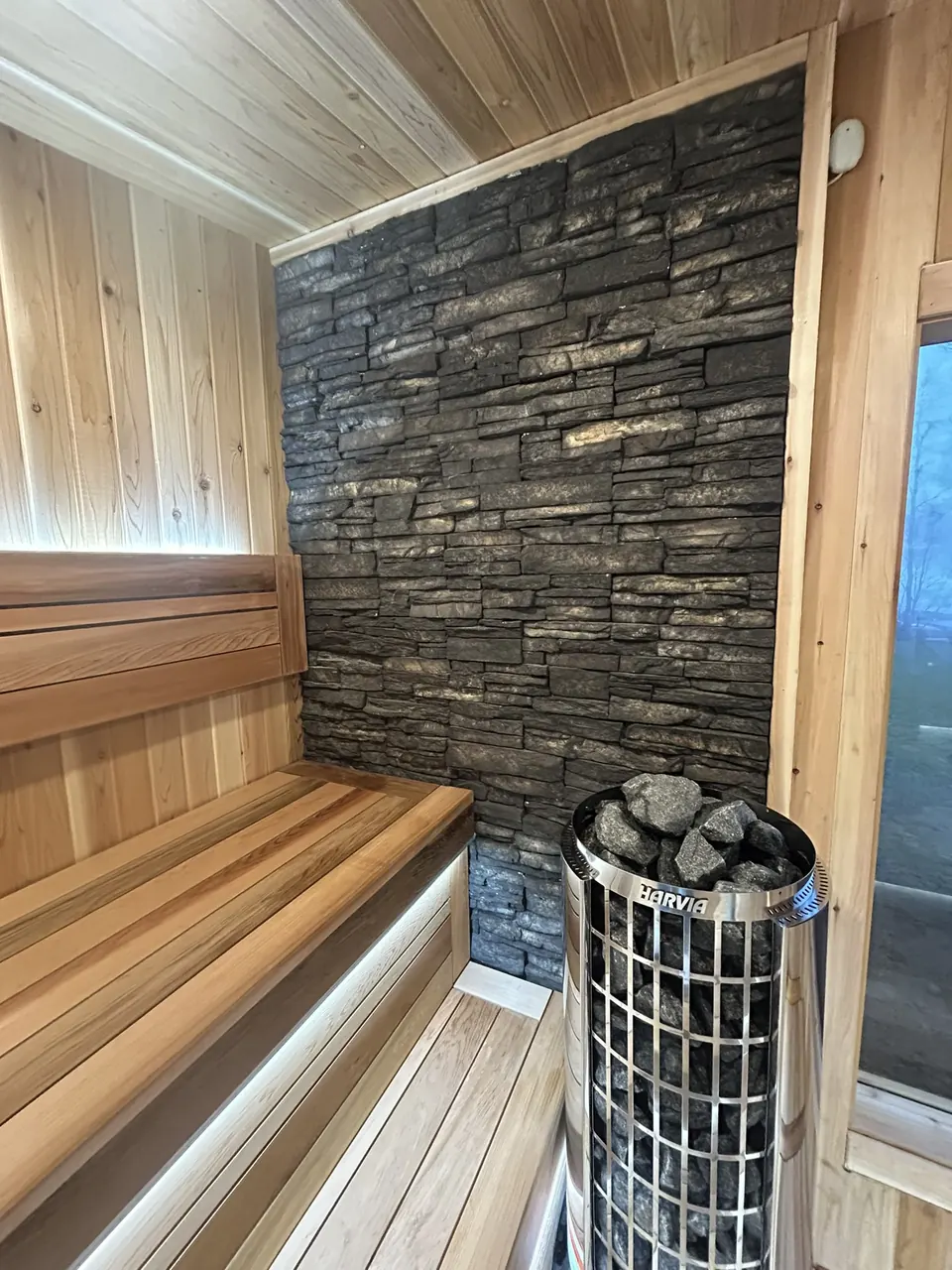 Backyard sauna: sauna heater wall and bench layout