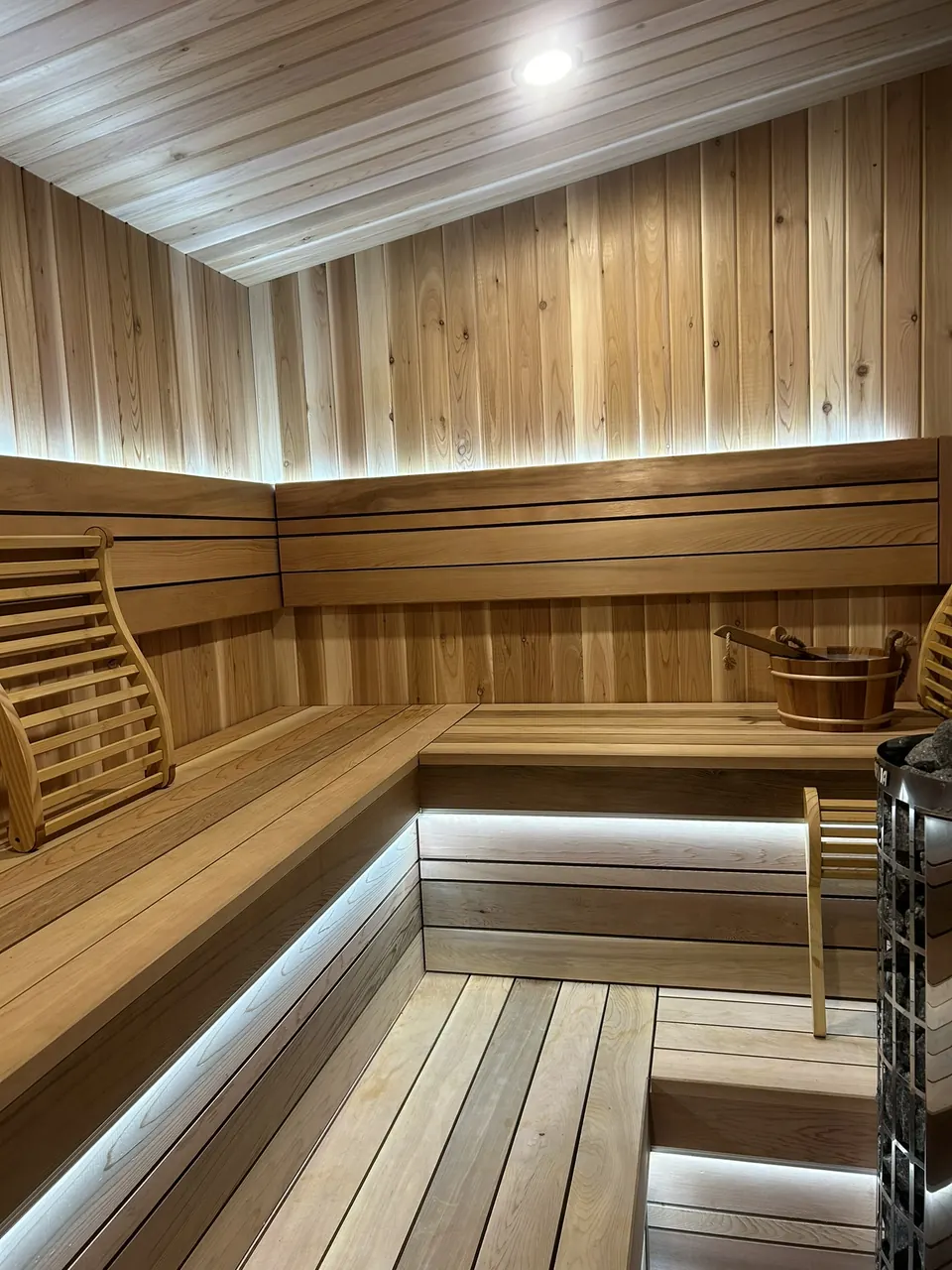 Backyard sauna: illuminated corner benches