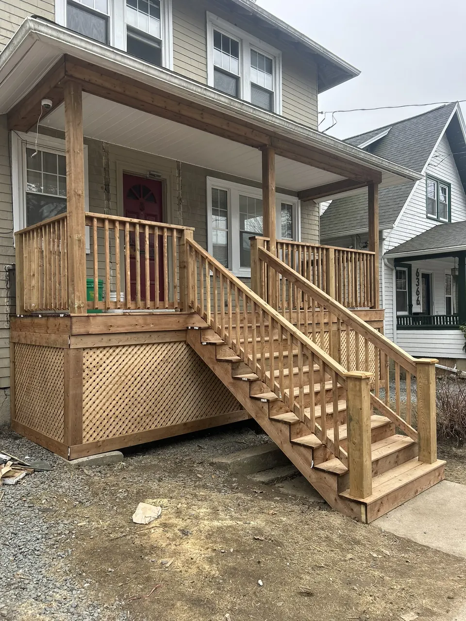 Covered wood entry: covered porch and stair run