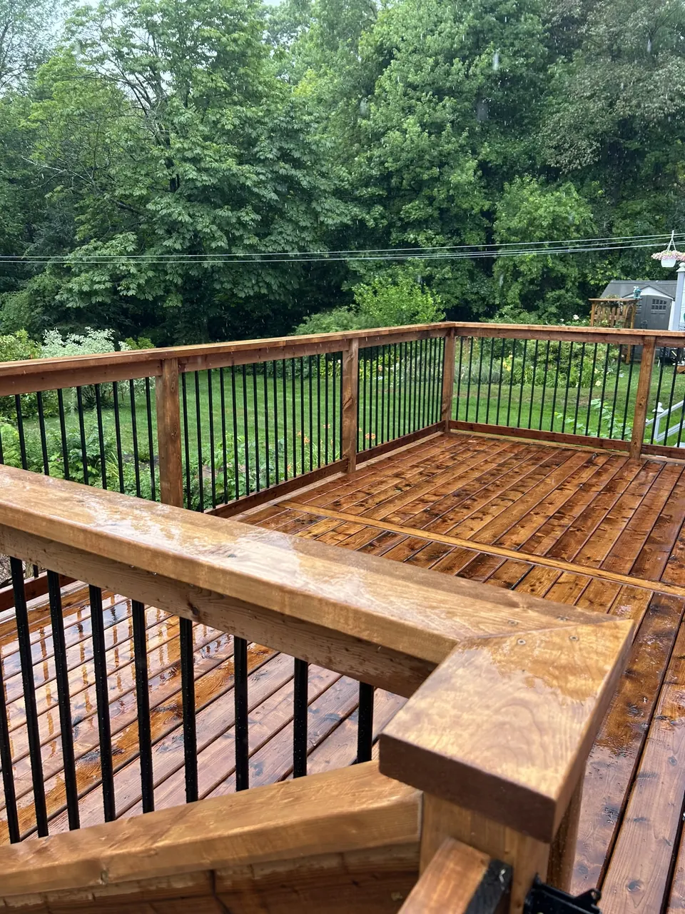 Raised wood deck: raised deck railing and garden outlook
