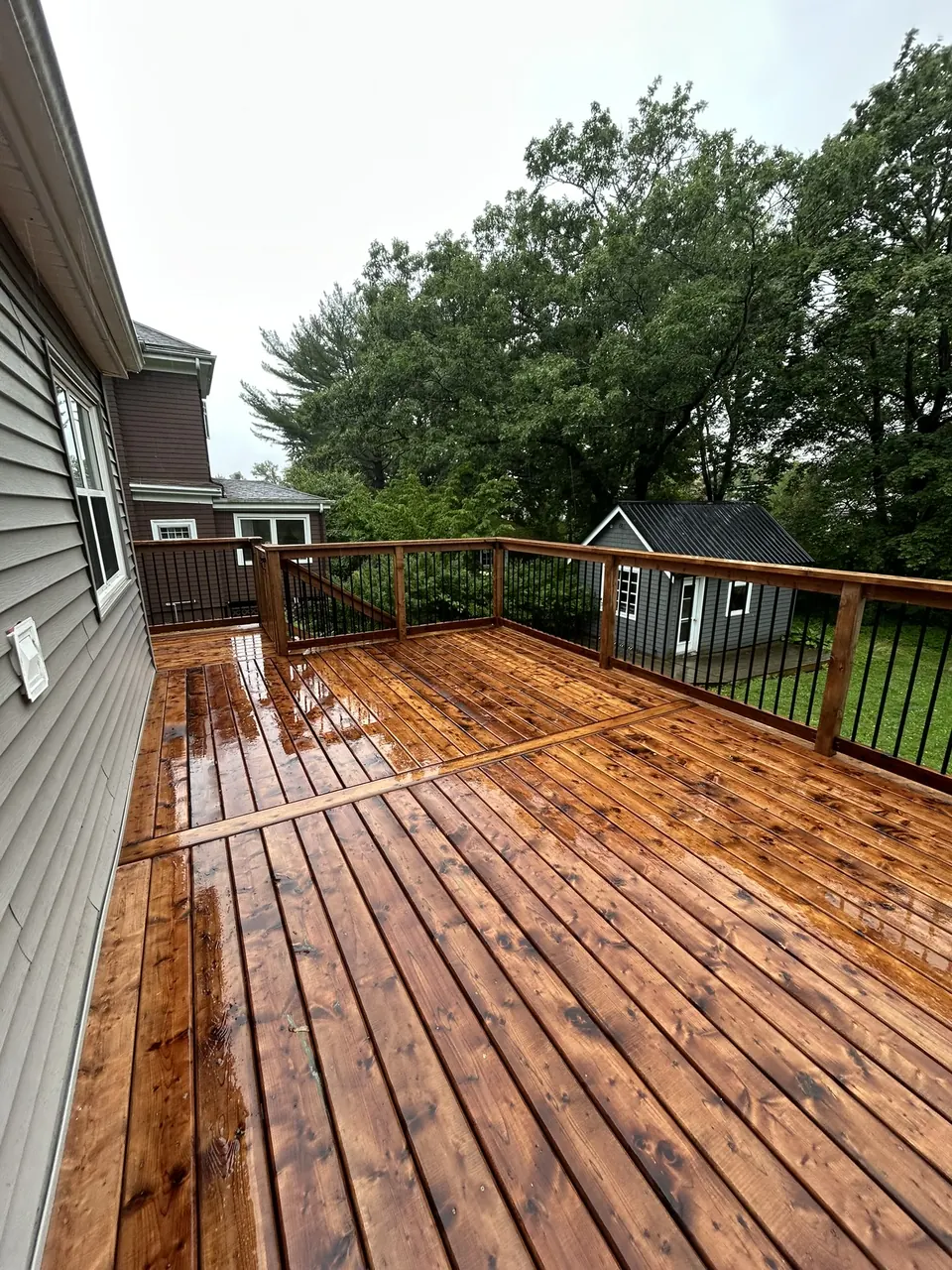 Raised wood deck: deck surface alongside the house