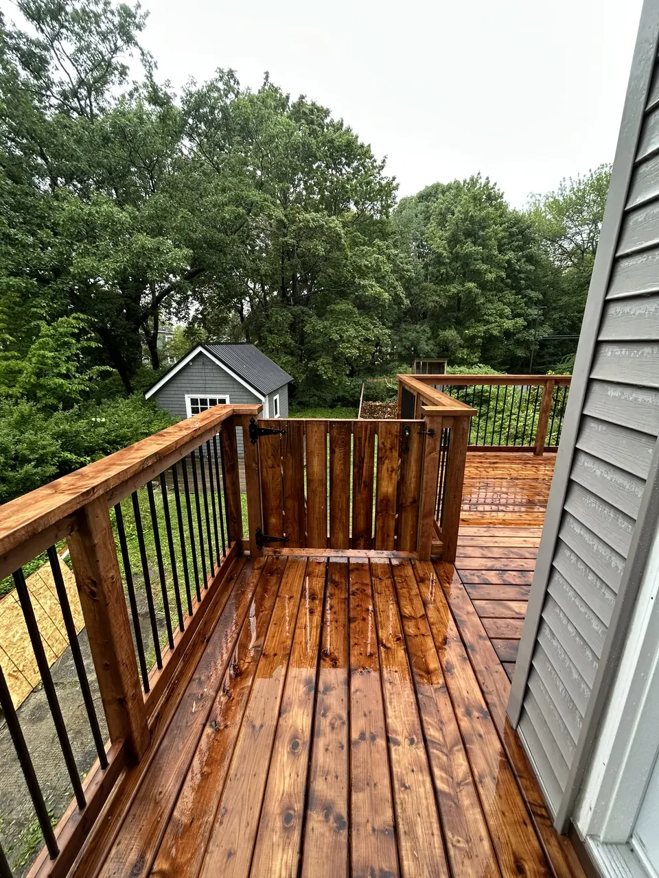 Raised wood deck: side landing and wood gate