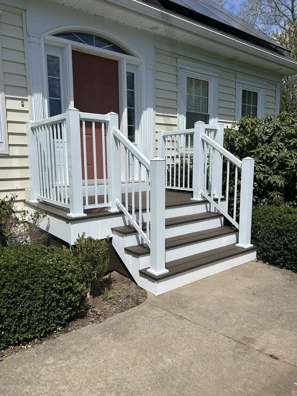 Red-door front entry: landscaped front approach
