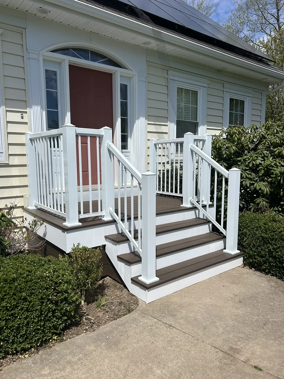 Red-door front entry: front entry from the curved approach