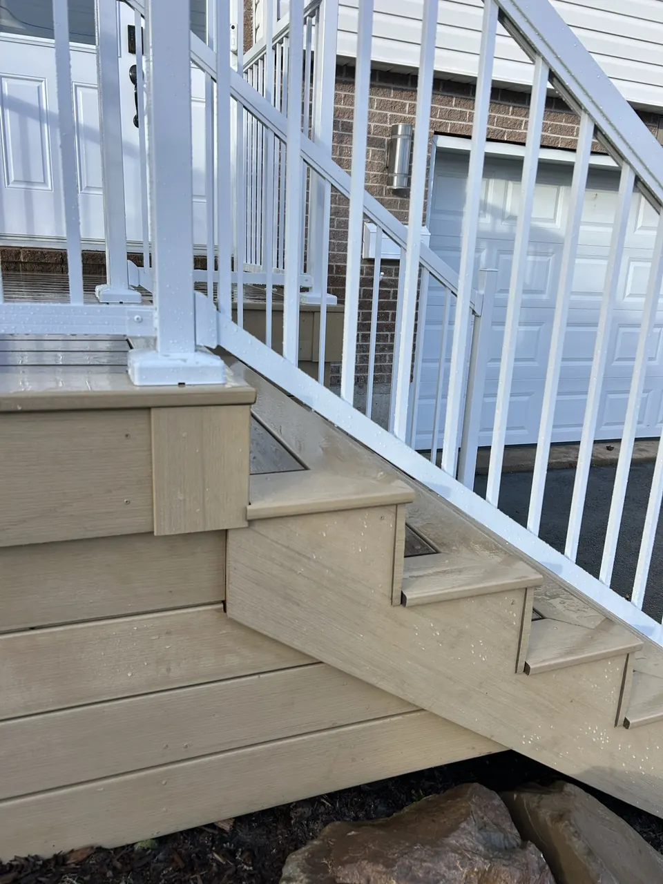 Tan deck & white rails: stair tread and railing detail