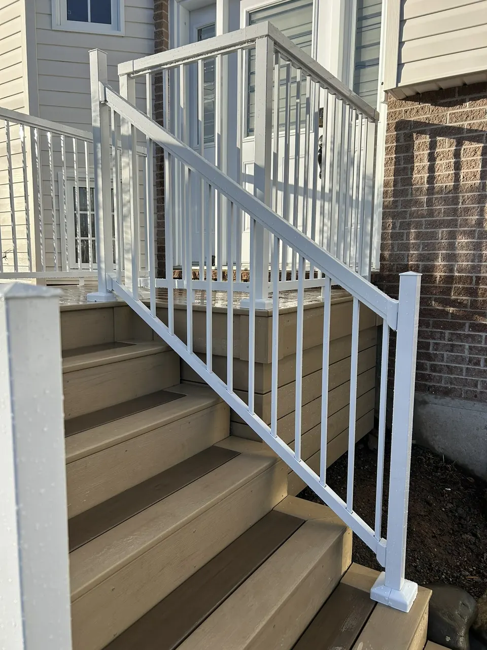 Tan deck & white rails: side approach
